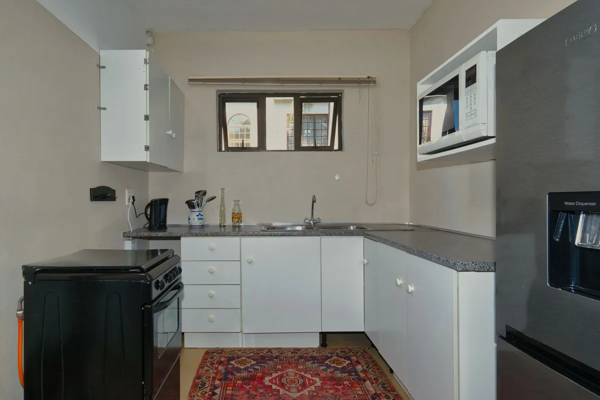 Small flat kitchen with very little free counter space