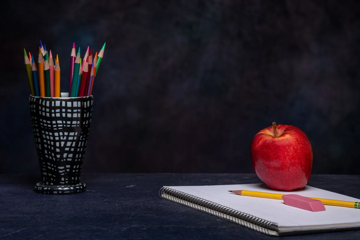 Notebooks and school supplies on a desk