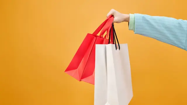 Shopping bags and wrapped gifts ready for Thanksgiving weekend