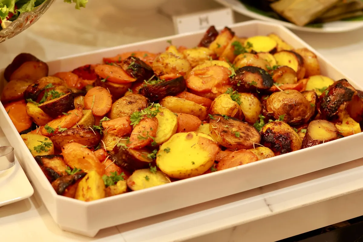 Sheet pan of chopped vegetables ready for a convection oven